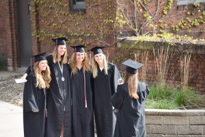 Group of Augsburg grads taking a photo